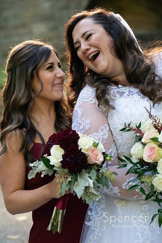 maid of honor smiling at laughing bride