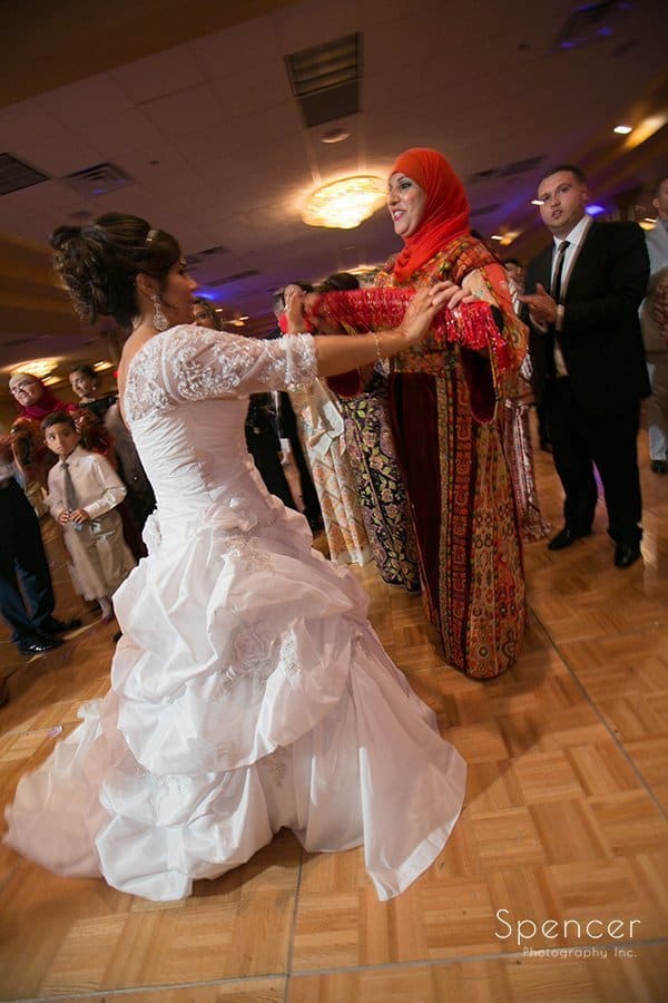 bride dancing with wedding guest