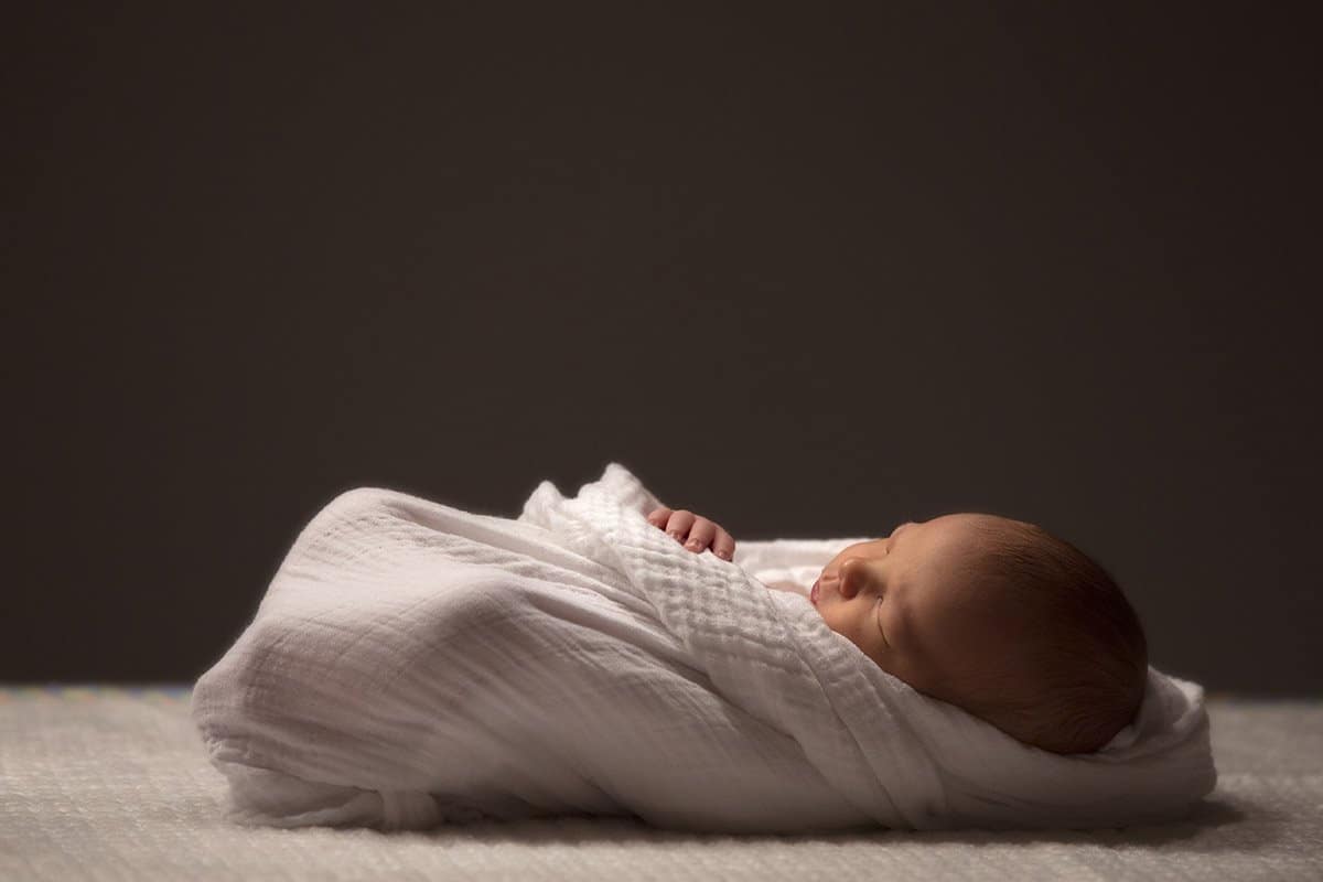 Simple newborn picture with swaddled baby
