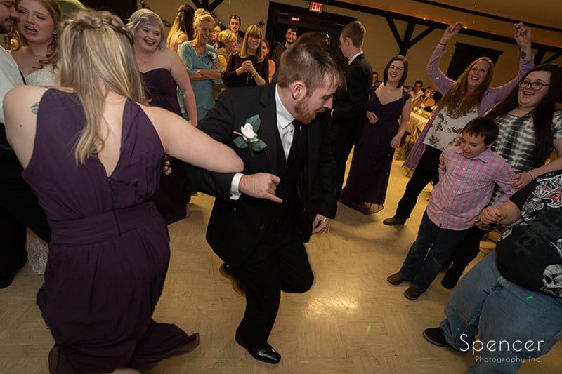 wedding guest dancing at reception