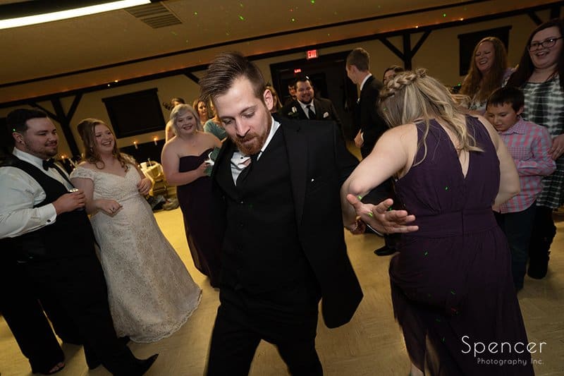 groomsmen dancing at wedding reception