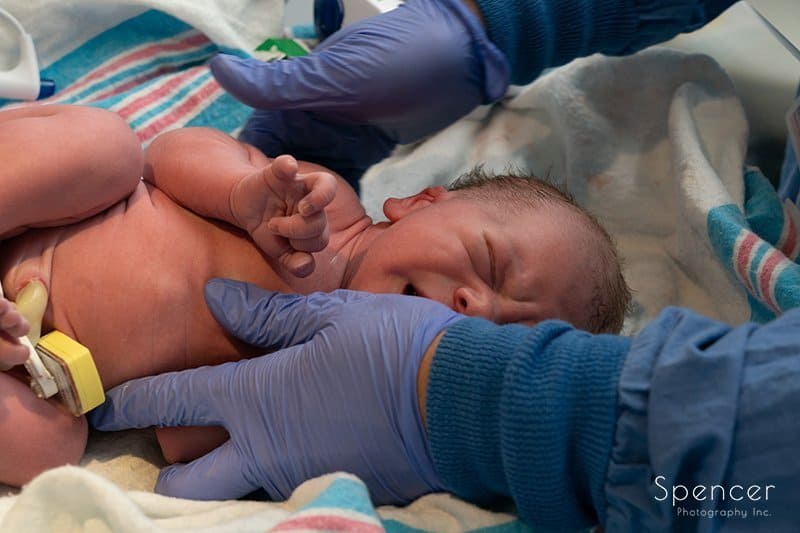 close up of newborn baby :: birth photography