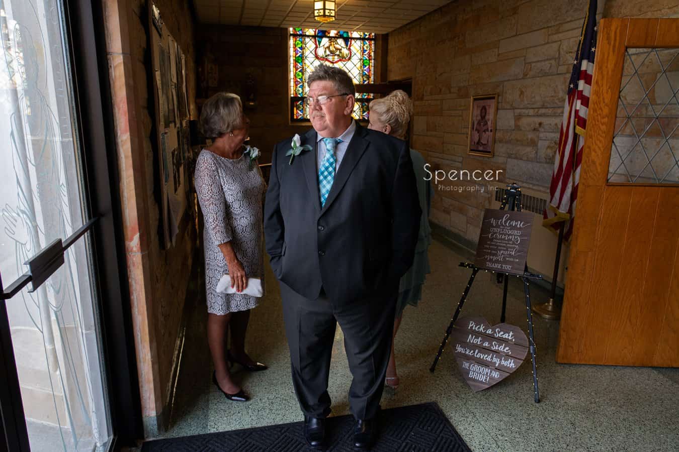 father of the bride standing in church