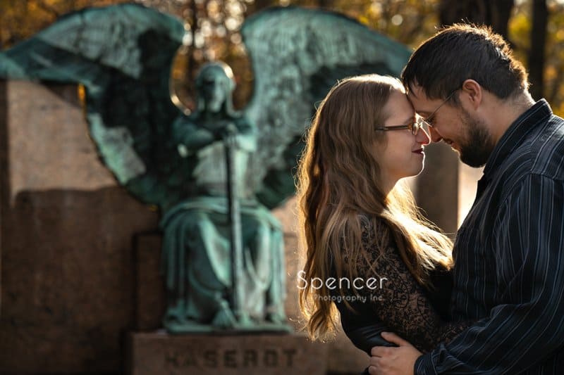 couple hugging in engagement pictures at Lakeview Cemetary Cleveland