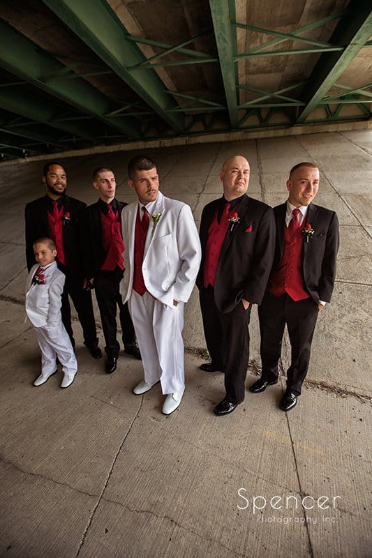 groomsmen in wedding picture under bridge in Strongsville