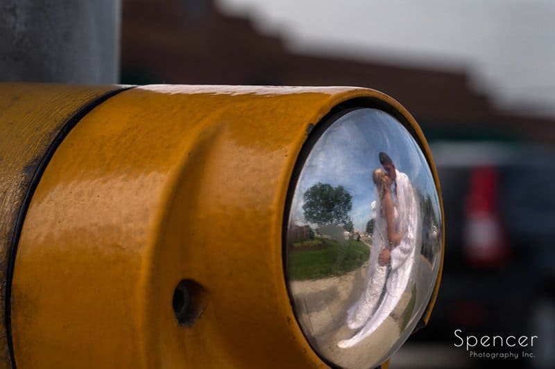 creative wedding picture with traffic signal in downtown Strongsville