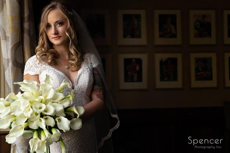 bride holding wedding bouquet at Firestone Country Club