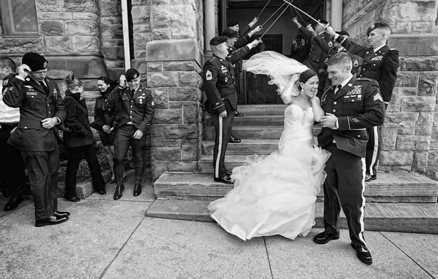 photojournalistic picture of wind blowing bride & groom in Cleveland