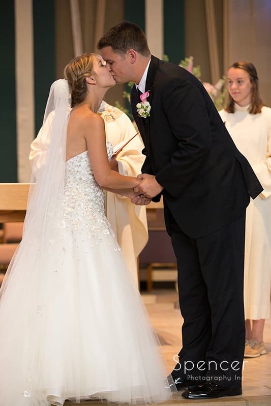 first kiss at wedding at St. Hilary