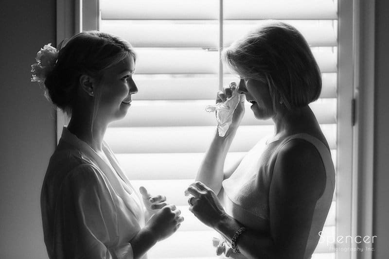 black and white picture of mom crying with bride