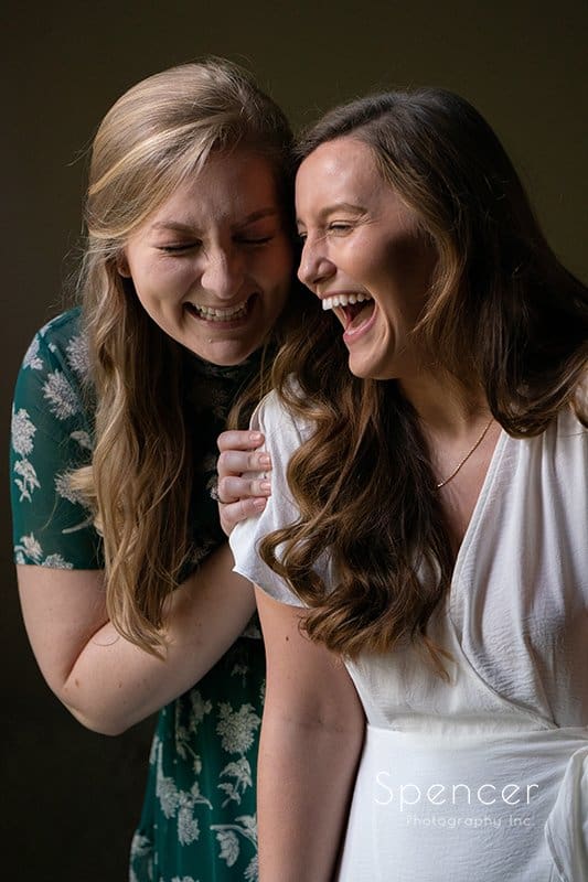  bride and maid of honor laughing