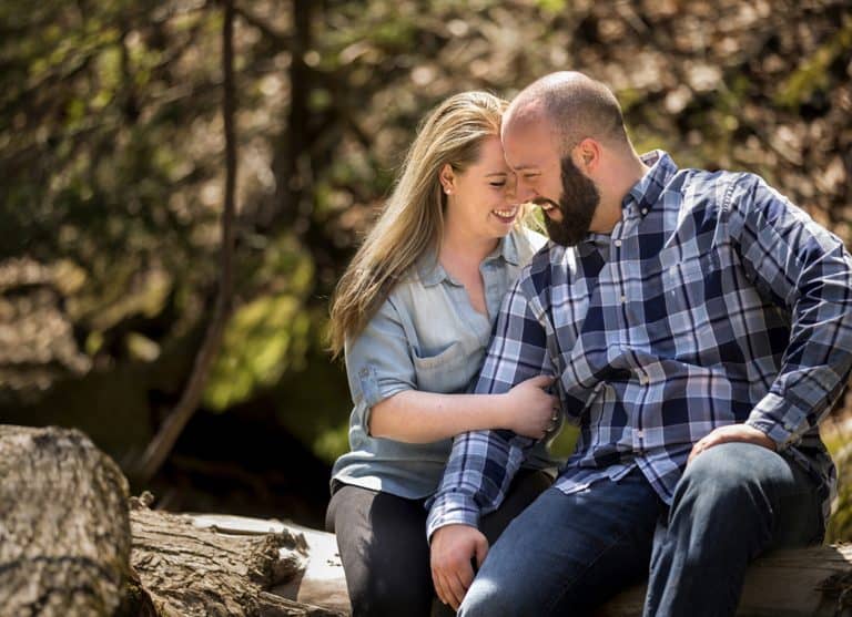 couple laughing during their engagement pictures in Cleveland Metroparks