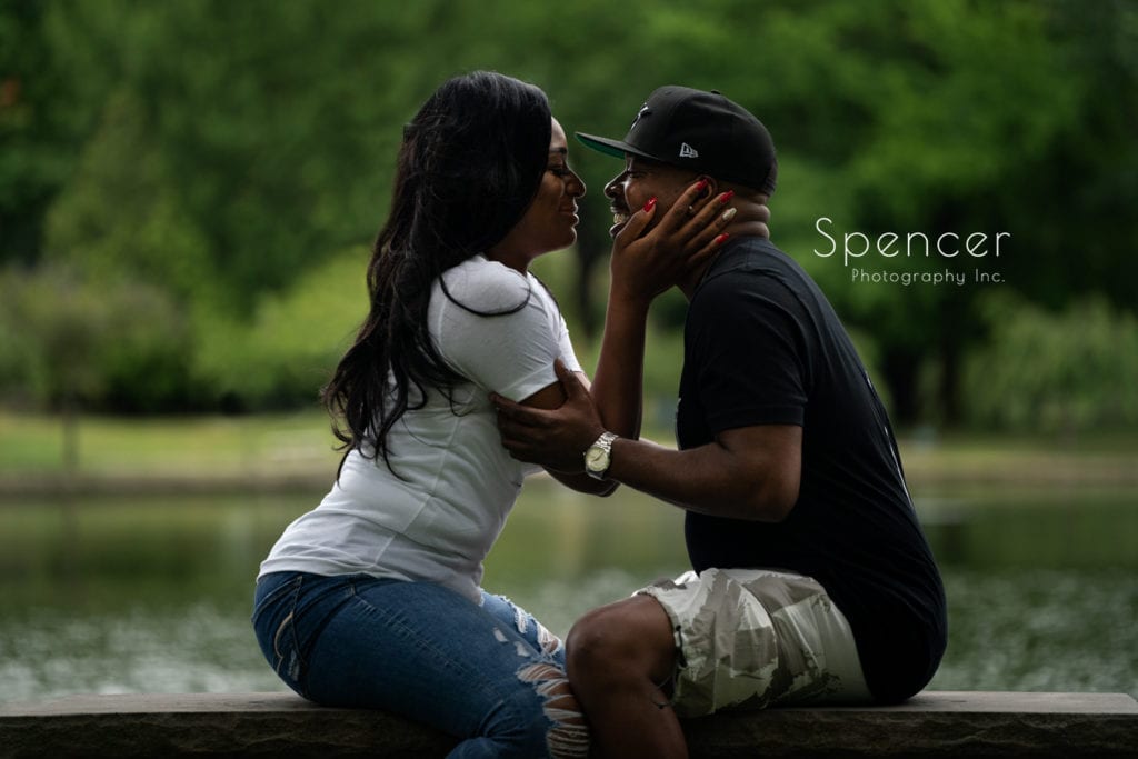 couple laughing in summer engagement picture at wade oval