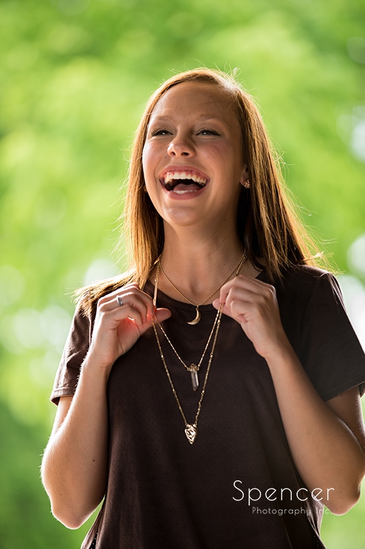 girl laughing in her senior pictures
