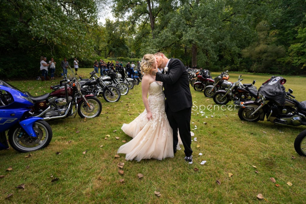 bride and groom kissing after their wedding ceremony