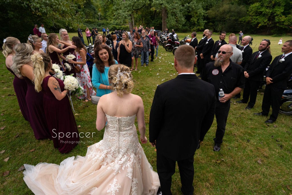 bride and groom greeting wedding guests