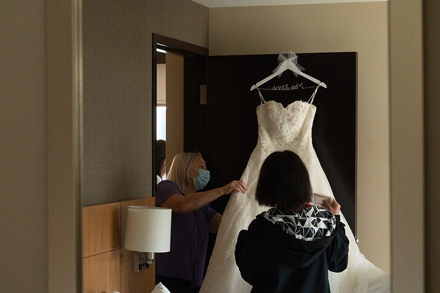 mom prepping brides dress at Hyatt Place Cleveland