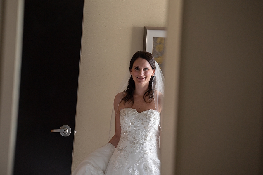 bride seeing herself in wedding dress for first time at Hyatt Place Cleveland