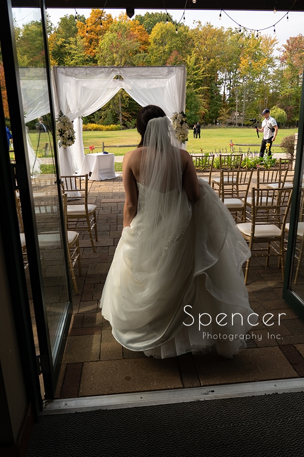  bride walking to see groom first time before wedding at Stonewater Cleveland