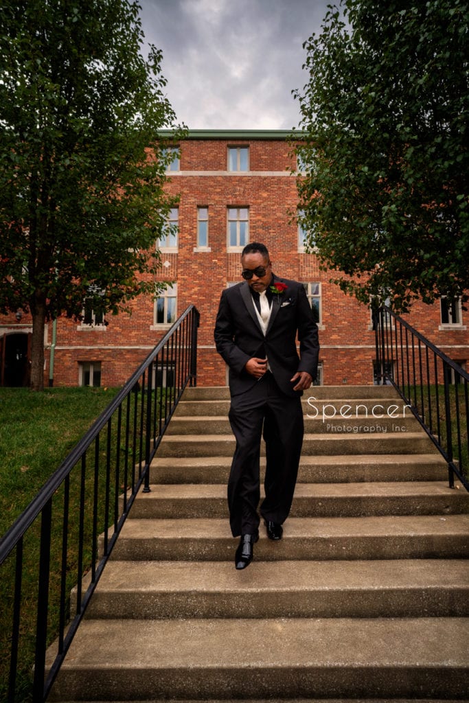 groom walking to his wedding ceremony at Glenmoor Country Club