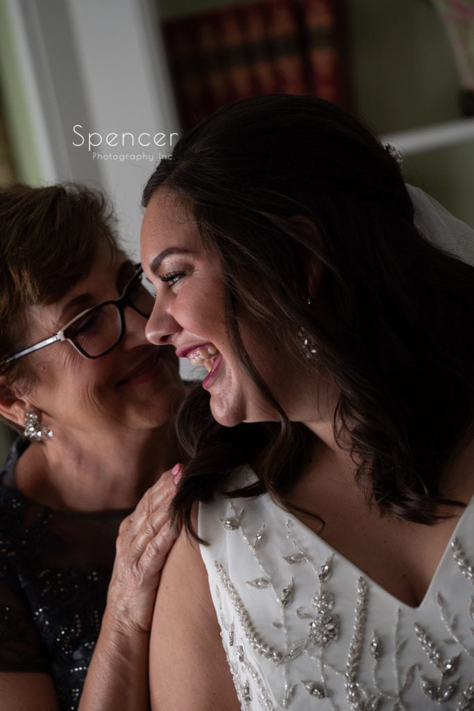 bride laughing with mom at the Club at Hillbrook