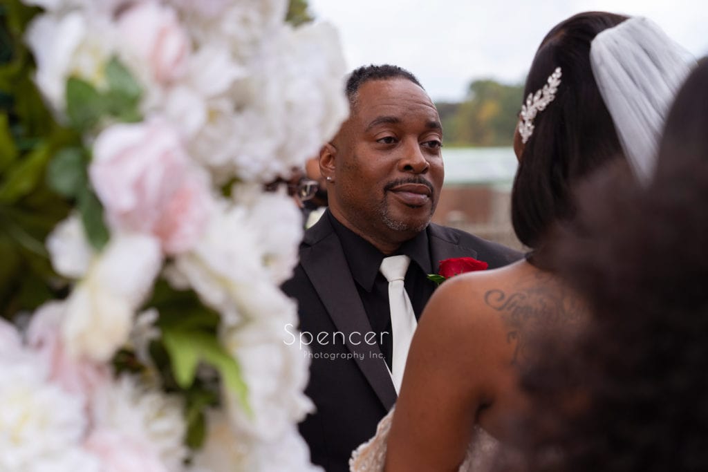 groom looking at bride during Glenmoor wedding ceremony