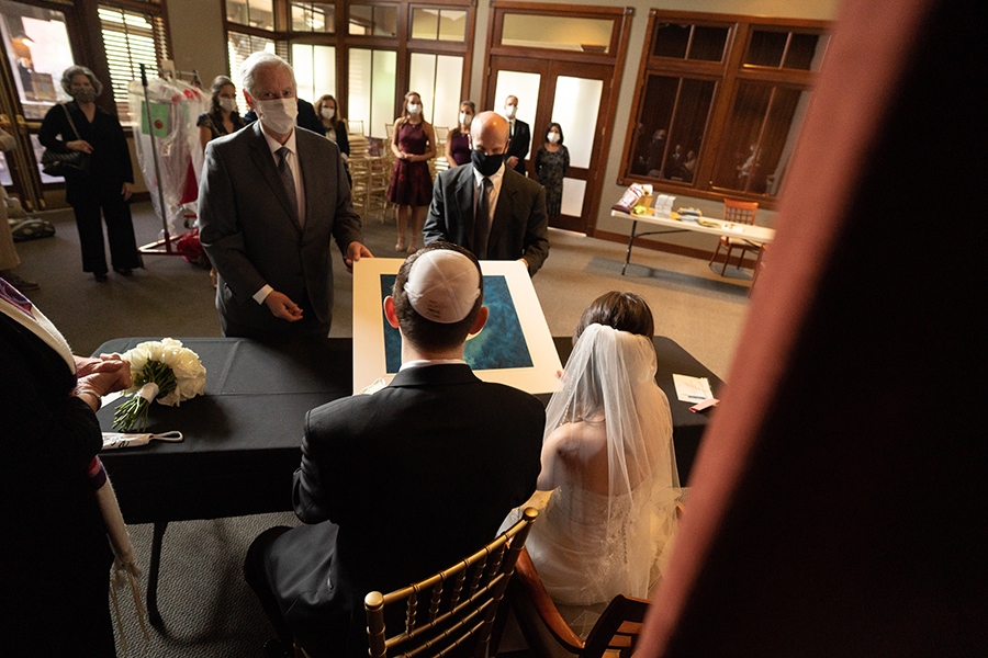 bride and groom at ketubah signing at Jewish wedding at Stonewater Cleveland