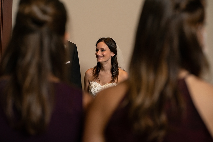 bride laughing at ketubah signing at Jewish wedding at Stonewater Cleveland
