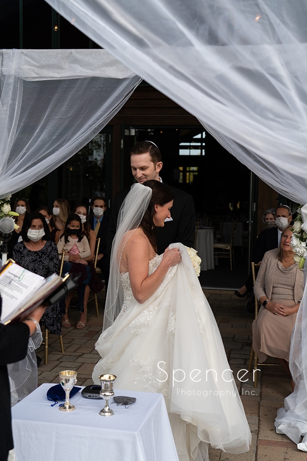 bride circles groom at Jewish wedding ceremony at Stonewater