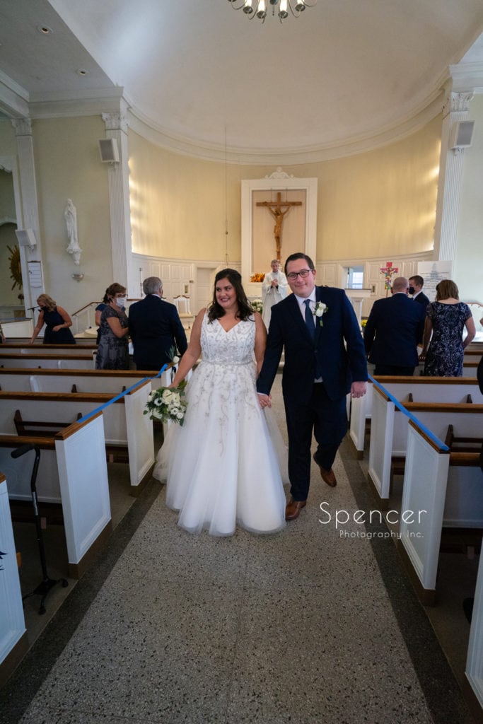 bride and groom recessional at St. Dominics in Shaker Heights