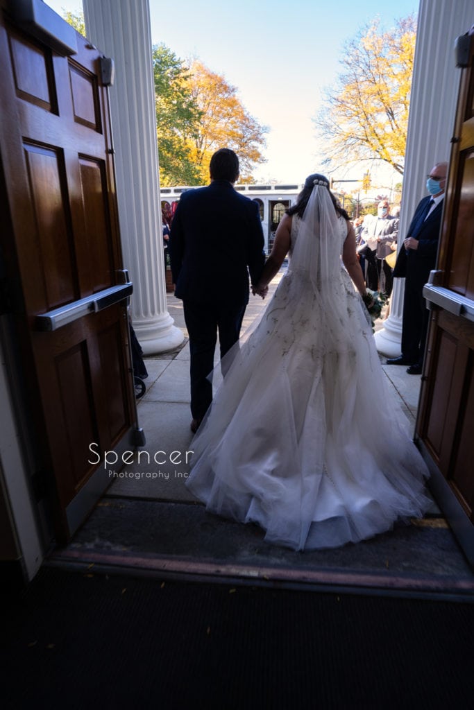 bride and groom exit wedding ceremony at St. Dominics in Shaker