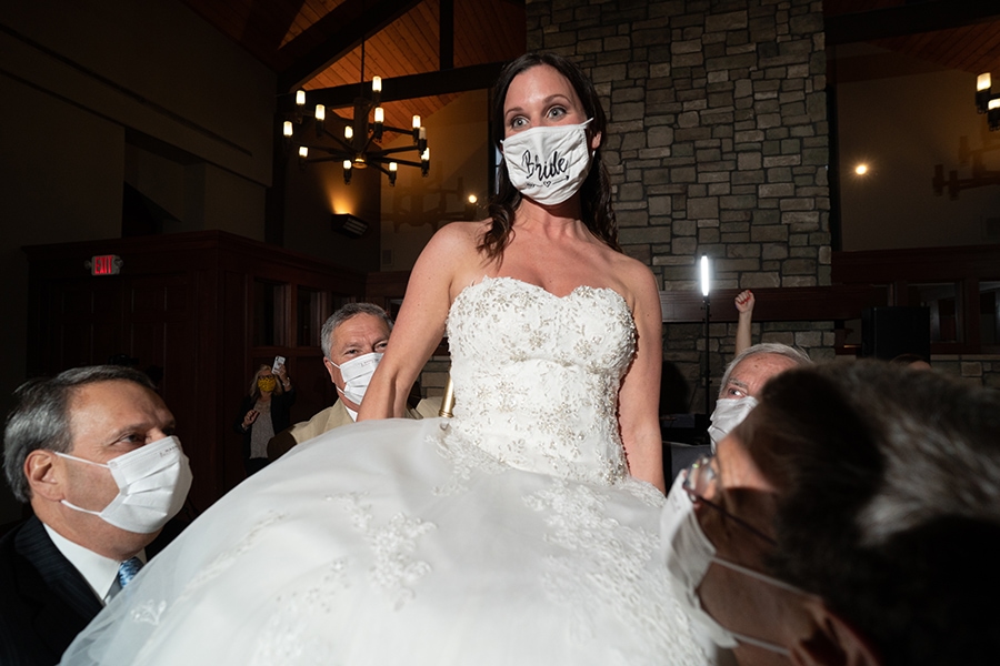 bride reacts during hora at wedding reception at Stonewater
