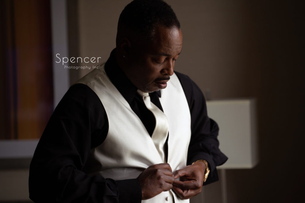 groom dressing for his wedding at Glenmoor Country Club