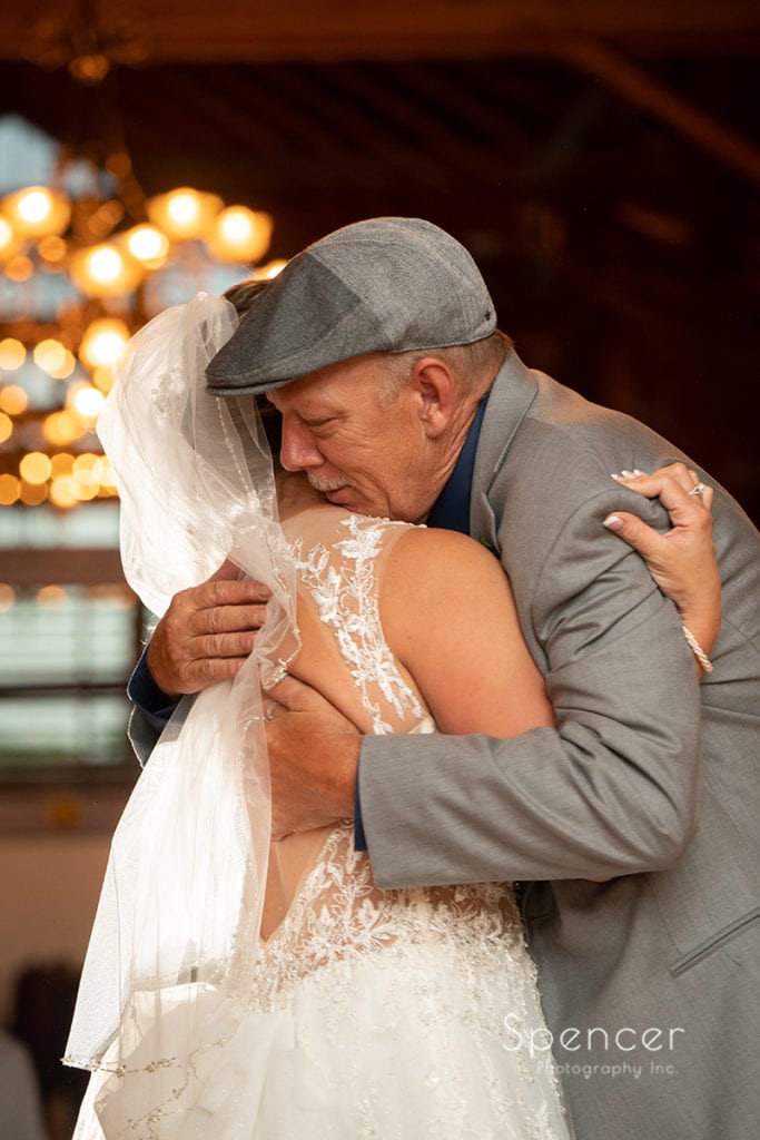 dad hugging bride