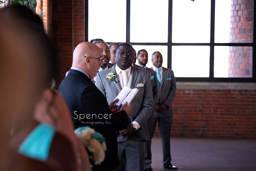 groom standing at wedding ceremony at Ariel Cleveland