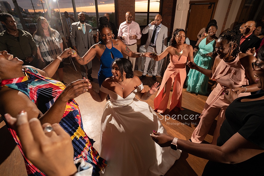 women dancing around bride
