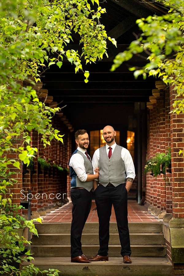 grooms standing on porch after gay wedding at Stan Hywet Akron