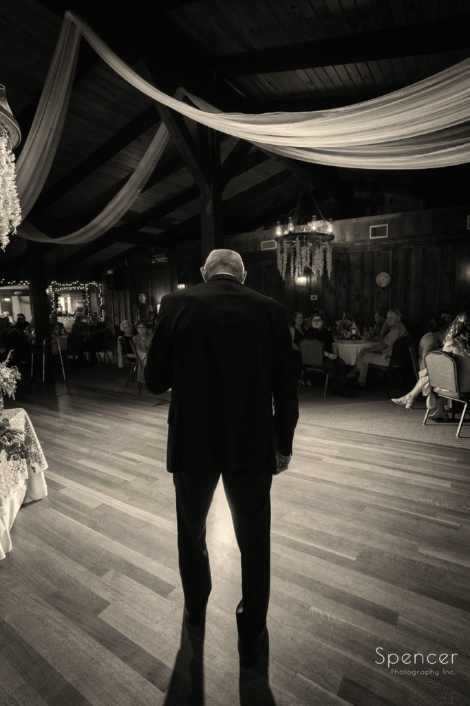 sepia picture of father of groom at Patterson Fruit Farm reception