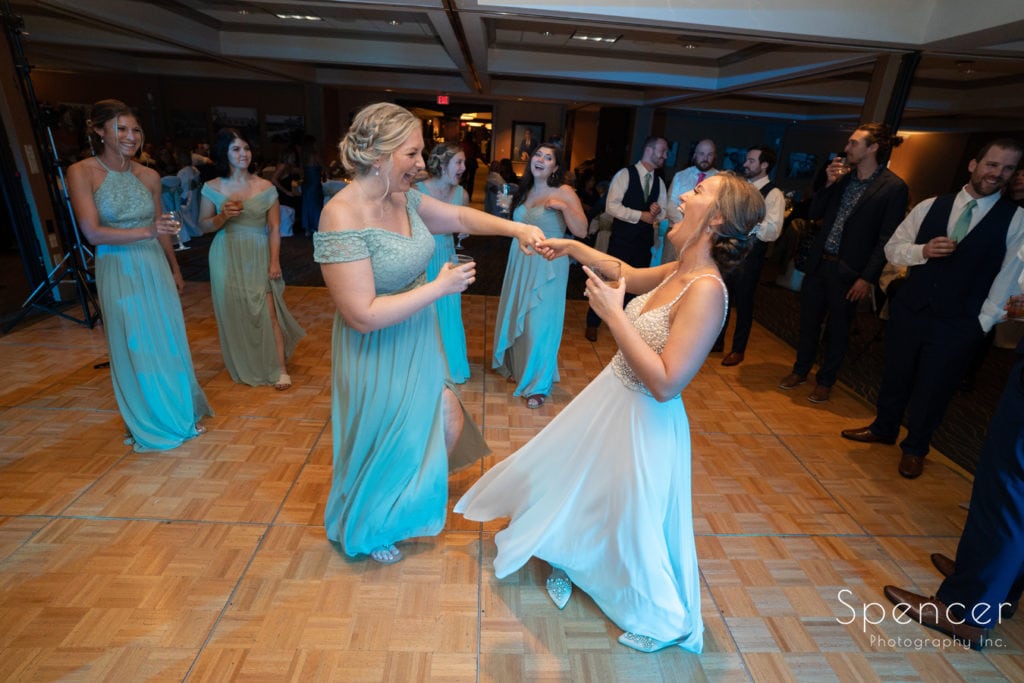 maid of honor dancing with bride