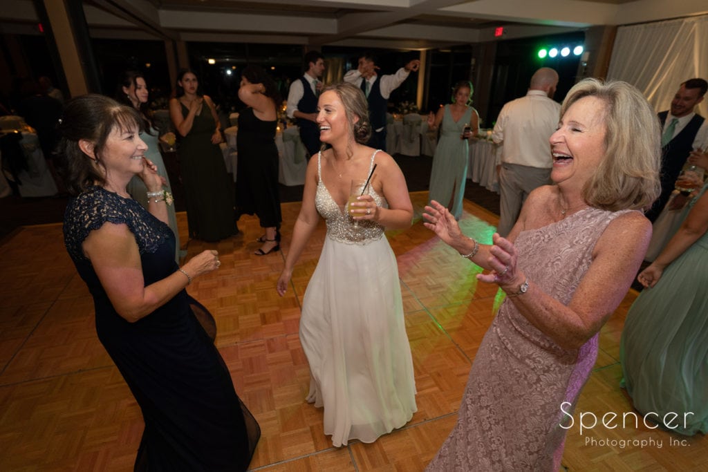 bride dancing with moms