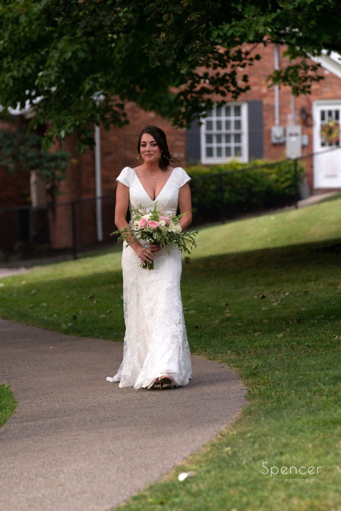 bride walking down path to wedding at Patterson Fruit Farm