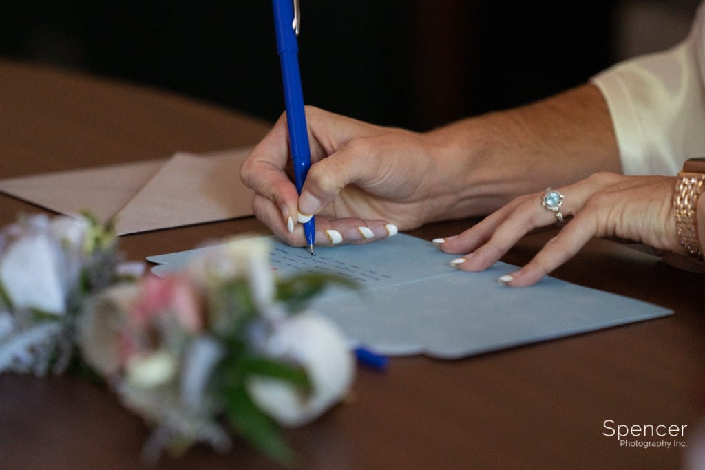 bride writing note to groom