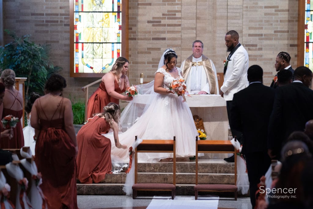 bride and groom at wedding altar