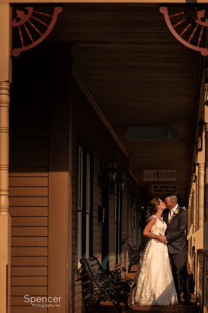 bride and groom kissing in Grand Pacific Junction Entertainment area