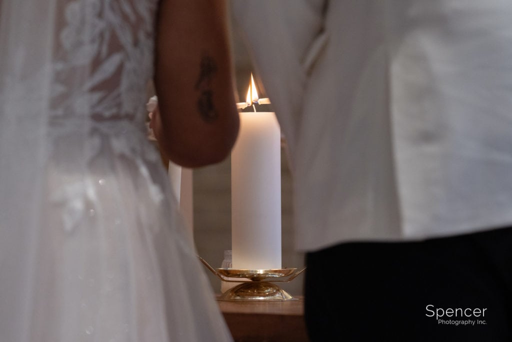 unity candle lighting during wedding ceremony