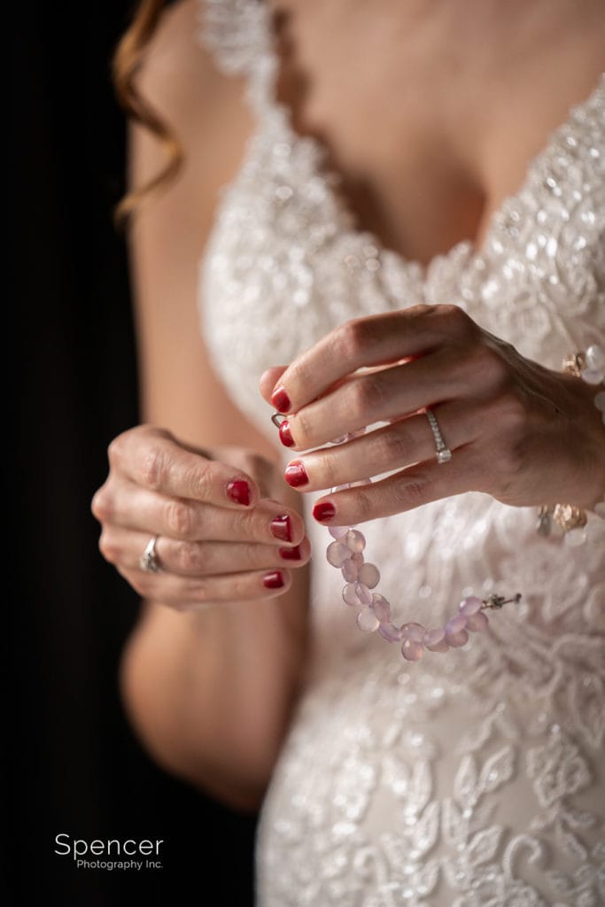 bride holding wedding bracelet