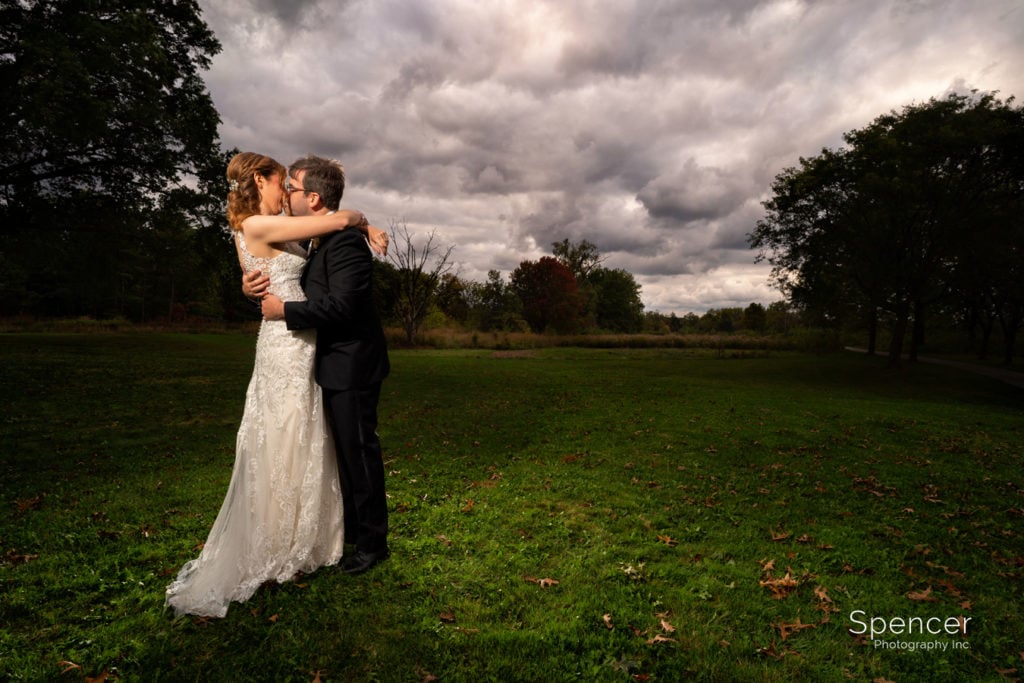 dramatic picture of bride and groom kissing in Beachwood