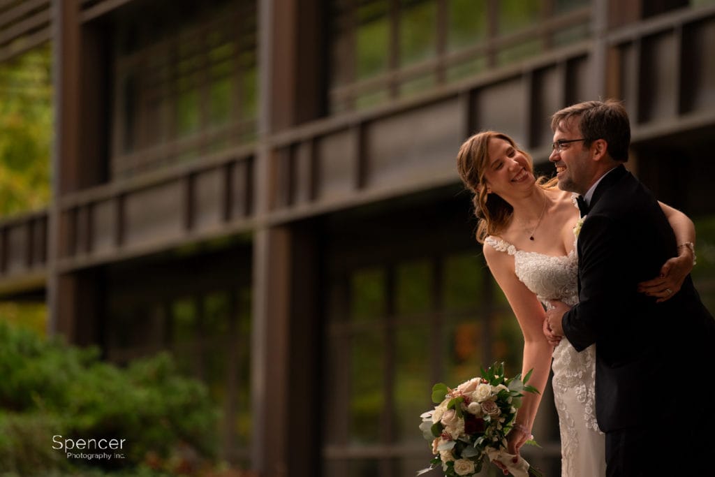bride and groom laughing in their fall wedding photo in cleveland