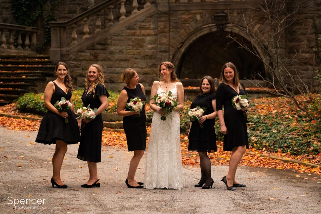 bride with bridesmaids after wedding in Beachwood