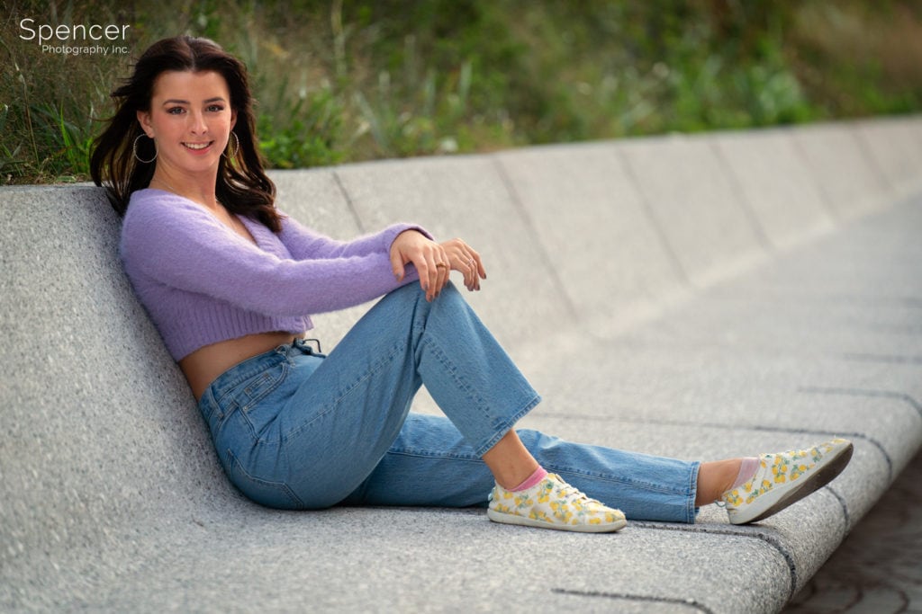 senior picture of girl on bench in downtown Cleveland